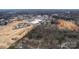 Aerial view showcases a home's proximity to a new development site at 244 Stilwell Oaks Cir, Charlotte, NC 28212