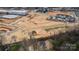 Aerial shot showing the house's location in a new development near apartments and retail at 244 Stilwell Oaks Cir, Charlotte, NC 28212