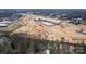 Aerial view highlighting a home's proximity to new construction site and surroundings at 244 Stilwell Oaks Cir, Charlotte, NC 28212