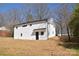 Renovated home featuring white brick, a new roof, and freshly landscaped yard at 244 Stilwell Oaks Cir, Charlotte, NC 28212