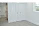 Bedroom with closet, barn door, and window at 244 Stilwell Oaks Cir, Charlotte, NC 28212