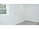 Bedroom with a window looking out to trees and neutral carpeting at 244 Stilwell Oaks Cir, Charlotte, NC 28212