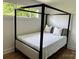 Bedroom with a canopy bed, wood floors, and windows at 244 Stilwell Oaks Cir, Charlotte, NC 28212