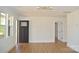 Bright entryway featuring a modern door and wood-look flooring at 244 Stilwell Oaks Cir, Charlotte, NC 28212