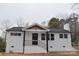 Charming front exterior with white brick, black accents, and a new roof at 244 Stilwell Oaks Cir, Charlotte, NC 28212
