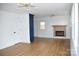 Bright living room with hardwood floors, fireplace, and ample natural light at 244 Stilwell Oaks Cir, Charlotte, NC 28212