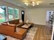 Well-lit living room with comfortable seating, stylish decor, and ample natural light at 244 Stilwell Oaks Cir, Charlotte, NC 28212