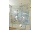 Modern walk-in shower featuring marble tile, built-in shelf and a gold-framed glass enclosure at 244 Stilwell Oaks Cir, Charlotte, NC 28212