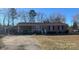 Charming brick ranch home featuring a convenient carport and a well-maintained front yard at 2458 Morningside Dr, Lancaster, SC 29720