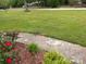 Lush front yard with beautiful landscaping and mature trees, creating a welcoming entrance at 2458 Morningside Dr, Lancaster, SC 29720