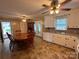 Eat-in kitchen featuring white cabinets, neutral countertops, and a classic table and chairs set at 2458 Morningside Dr, Lancaster, SC 29720