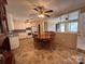 Eat-in kitchen features classic white cabinets and a view into the living room at 2458 Morningside Dr, Lancaster, SC 29720