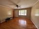 Bright living room featuring hardwood floors, neutral walls, and large windows at 2458 Morningside Dr, Lancaster, SC 29720