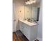 Bathroom vanity with sink, mirror, and ample storage with black and white floor mat at 3032 Morning Glory Ln, Vale, NC 28168