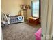 A well-lit bedroom featuring a cozy bed with stuffed animals and a large window at 3032 Morning Glory Ln, Vale, NC 28168
