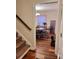 Dining area with hardwood floors, adjacent to the staircase, perfect for Gathering meals and gatherings at 3032 Morning Glory Ln, Vale, NC 28168