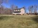 Charming two-story home featuring a welcoming front porch and a spacious yard, perfect for outdoor activities at 3032 Morning Glory Ln, Vale, NC 28168