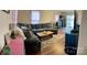 Comfortable living room features a sectional sofa, area rug, and wood flooring at 3032 Morning Glory Ln, Vale, NC 28168