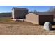 A detached building with an outdoor patio area creates extra space for parking and gardening at 3032 Morning Glory Ln, Vale, NC 28168
