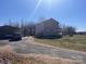 The rear of the house has an attached carport, providing convenient covered parking at 3032 Morning Glory Ln, Vale, NC 28168