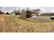 Large rear yard with a three bay carport plus boat storage and additional lawn equipment at 3032 Morning Glory Ln, Vale, NC 28168