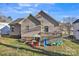 The home has a fenced backyard and a deck with play equipment at 306 Chinaberry Dr, China Grove, NC 28023