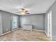 Spacious bedroom with natural light, featuring hardwood floors and grey accent wall at 306 Chinaberry Dr, China Grove, NC 28023