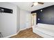 This bedroom features neutral walls, a dark accent wall, and light wood laminate flooring at 306 Chinaberry Dr, China Grove, NC 28023