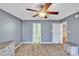 Bright bedroom with light hardwood flooring and ensuite bath at 306 Chinaberry Dr, China Grove, NC 28023