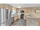 Bright eat-in kitchen with stainless steel appliances and light wood cabinets at 306 Chinaberry Dr, China Grove, NC 28023