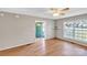 Bright living room with hardwood floors, a ceiling fan, and a view of the front yard at 306 Chinaberry Dr, China Grove, NC 28023