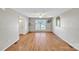 Open living space featuring polished hardwood floors, natural light, and neutral wall colors at 306 Chinaberry Dr, China Grove, NC 28023