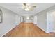 Open-concept living space featuring hardwood flooring seamlessly connecting to the kitchen area at 306 Chinaberry Dr, China Grove, NC 28023