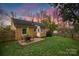 Charming backyard featuring a brick patio, fenced yard, and exterior brick on the house at 4010 Hiddenbrook Dr, Charlotte, NC 28205