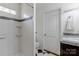 Bright bathroom featuring a tiled shower, black and white tile floors, and granite vanity at 4010 Hiddenbrook Dr, Charlotte, NC 28205