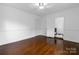 The bedroom features hardwood floors and a ceiling fan at 4010 Hiddenbrook Dr, Charlotte, NC 28205
