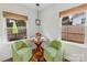 Eat-in kitchen area with hardwood floors, bright windows, and a view of the backyard at 4010 Hiddenbrook Dr, Charlotte, NC 28205