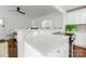 Eat-in kitchen area with bar seating and stone countertops at 4010 Hiddenbrook Dr, Charlotte, NC 28205