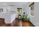 Bright kitchen features white cabinets, stone countertops, and hardwood floors at 4010 Hiddenbrook Dr, Charlotte, NC 28205