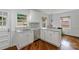 Renovated kitchen features stainless steel appliances, a sink, and ample cabinet space at 4010 Hiddenbrook Dr, Charlotte, NC 28205