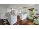 Spacious kitchen with stainless steel appliances, bar seating and hardwood floors at 4010 Hiddenbrook Dr, Charlotte, NC 28205