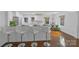 Modern kitchen with marble countertops, breakfast bar, and stainless steel appliances at 4010 Hiddenbrook Dr, Charlotte, NC 28205