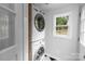 Convenient laundry room with new washer and dryer at 4010 Hiddenbrook Dr, Charlotte, NC 28205
