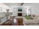 Open-concept living area with fireplace, breakfast bar, and hardwood floors at 4010 Hiddenbrook Dr, Charlotte, NC 28205
