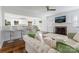 Spacious living room with fireplace, breakfast bar, and hardwood floors at 4010 Hiddenbrook Dr, Charlotte, NC 28205