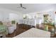 Open-concept living area with breakfast bar, hardwood floors, and abundant natural light at 4010 Hiddenbrook Dr, Charlotte, NC 28205