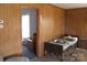 Bedroom with paneled walls, offering a cozy atmosphere and space for relaxation at 438 Pop Davis Rd, Taylorsville, NC 28681