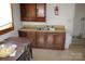 Traditional kitchen with wooden cabinets and a sink, ready for renovation at 438 Pop Davis Rd, Taylorsville, NC 28681