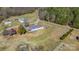Expansive aerial view of the property, showcasing the house, outbuildings, and surrounding landscape at 4783 Rainey Ln, Maiden, NC 28650