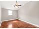 Bedroom features hardwood floors, natural light, and a ceiling fan at 4783 Rainey Ln, Maiden, NC 28650